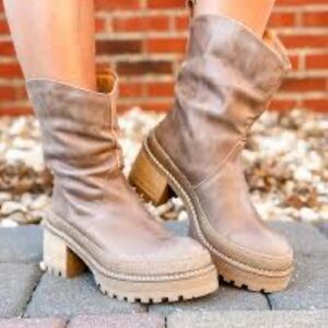 NWOT. Retail $268. Size 9 FREE PEOPLE “Mel Slouch” leather boots.
